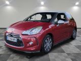 the red citrole is parked on a checkered floor