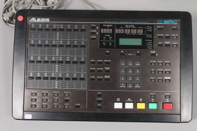 a black control panel with multiple buttons and wires on it