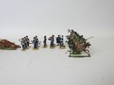 several figurines of men in uniforms on horses and a man on a horse