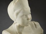 marble bust of a child with a hat on his head