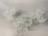 a lot of glasses that are sitting on a table