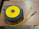 a yellow and black hose sitting on top of a wooden table