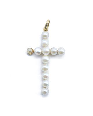 une image représentant une croix composée de perles sur fond blanc