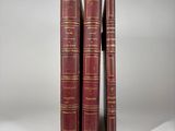 a pair of red books sitting on top of each other