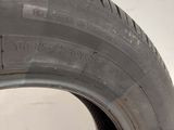 a close up of a tire on a white surface with a white background