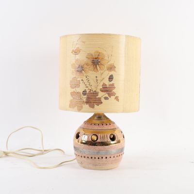 a lamp that is sitting on a table next to a cord