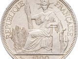an image of a silver coin with a statue of a woman sitting on a chair