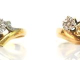 pair of gold and diamond earrings on white background with reflection