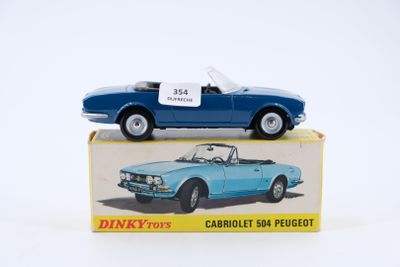 a blue toy car sitting on top of a box