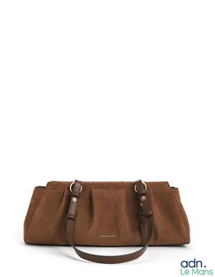 an image of a brown handbag on a white background
