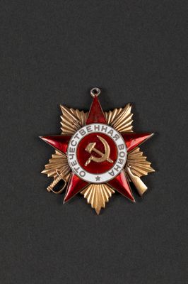 a close up of a red star with a hammer and stars on it