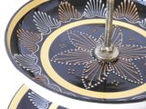 two tiered plates with decorative designs on them