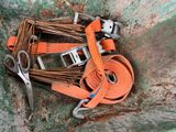 a pair of scissors and a belt laying on a rock
