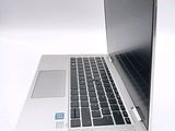 a close up of a laptop computer on a white surface