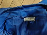 the jacket is blue and has a white label on it