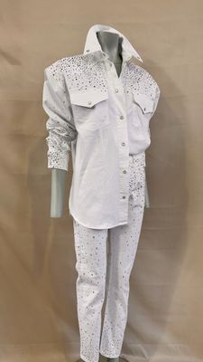 michael jackson ' s white shirt and pants on display in front of a beige backdrop