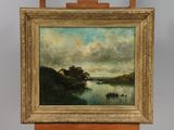 painting on easel of a landscape with a river and trees