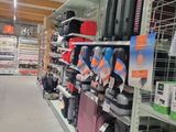 many suitcases that are on the shelves in the store