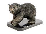 a statue of a bear that is on a marble base