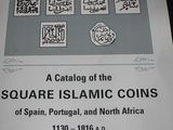 a book with a picture of islamic coins on it