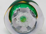 a close up of a glass object on a white surface