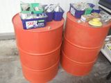 two orange barrels sitting next to each other on the floor