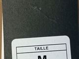 a tag that says taille m on it