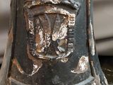 a close up of a metal bell on a table