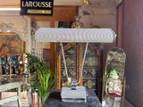 a desk with a lamp on top of it in a room