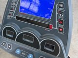 an image of a close up of a tread machine with a blue screen on it