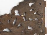 a wooden wall hanging with a picture of a man riding a horse