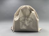 a drawsack bag with a logo on it sitting on a table