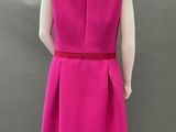 a pink dress with a red belt on a mannequin mannequin mannequin mannequin mannequin mannequin mannequin manne