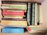 a box full of books sitting on top of a table