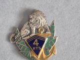 une image représentant un insigne métallique orné d'un lion
