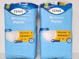 two packs of tena protection pants sitting on top of each other