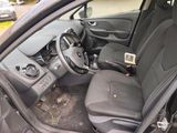 the interior of a car with the door open and the driver seat down