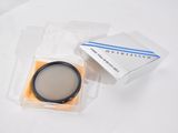 a close up of a camera lens in a plastic box