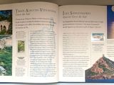 an open book on a shelf with pictures on it
