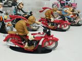many figurines of cartoon characters riding on motorcycles