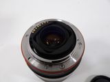 a close up of a camera lens on a white surface