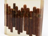 cigars in a clear acrylic box on a white background