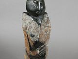an image of a sculpture of a man with a hat on his head