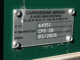 a close up of a sign on the side of a green bus