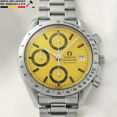 an image of a watch with a yellow face on a white surface