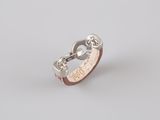 a close up of a ring on a white surface