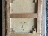 an old picture of a wooden frame with a number on it
