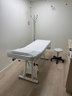 an image of a room with a table and a chair