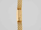 an 18k gold wrist watch with a diamond set clasp