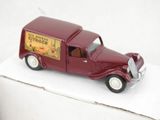 a toy truck that is sitting on a white surface